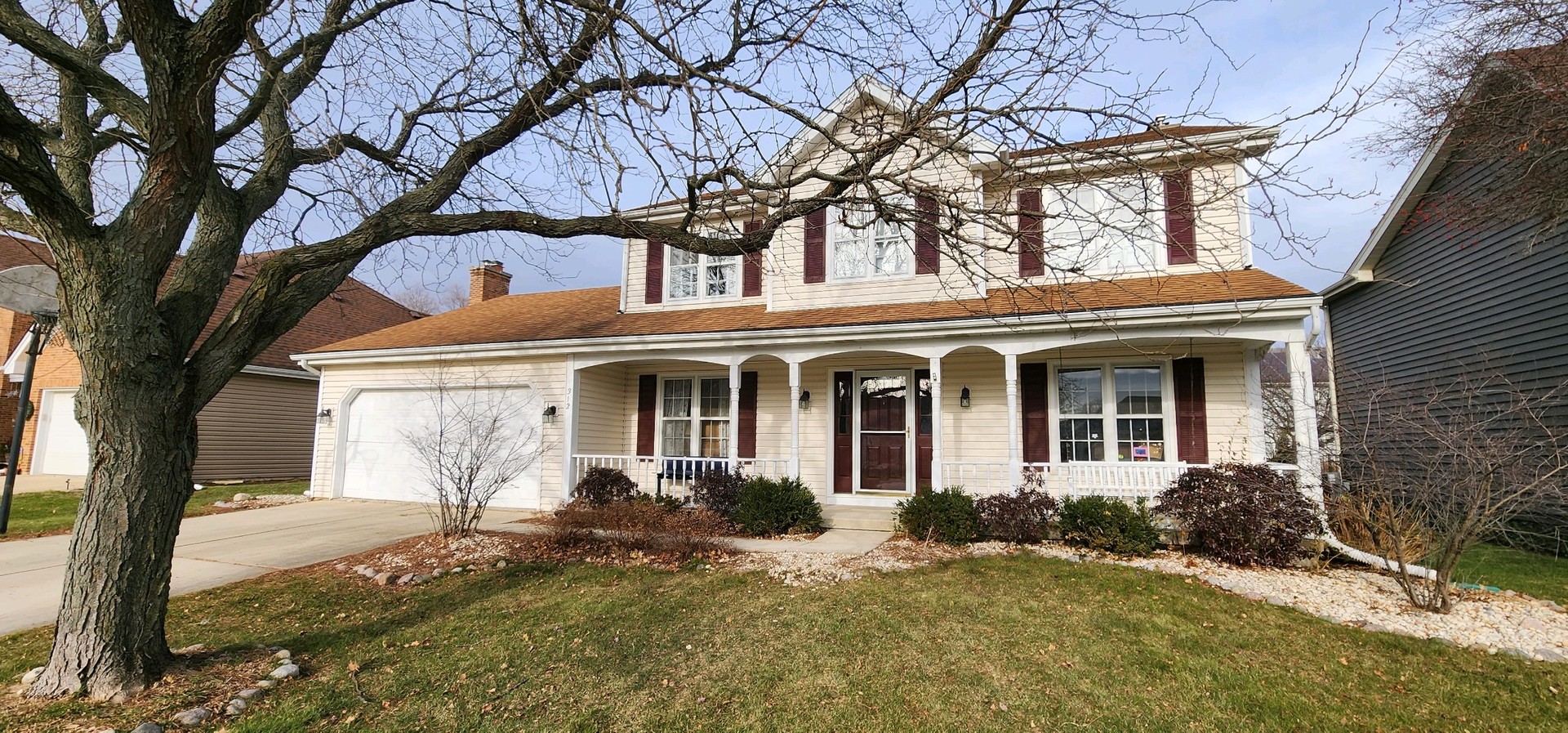 a front view of a house with a yard