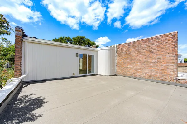 an aerial view of a house with outdoor space