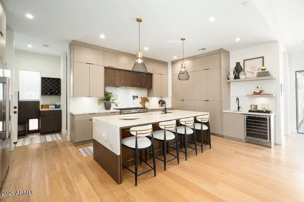 a large kitchen with a table and chairs
