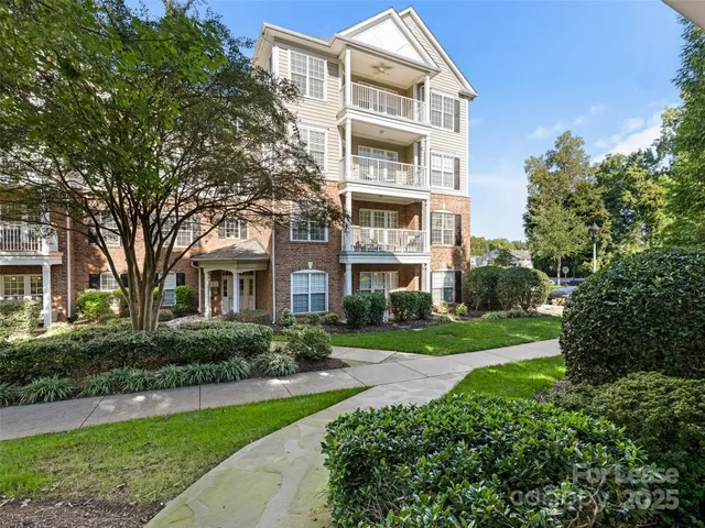 a front view of a building with garden
