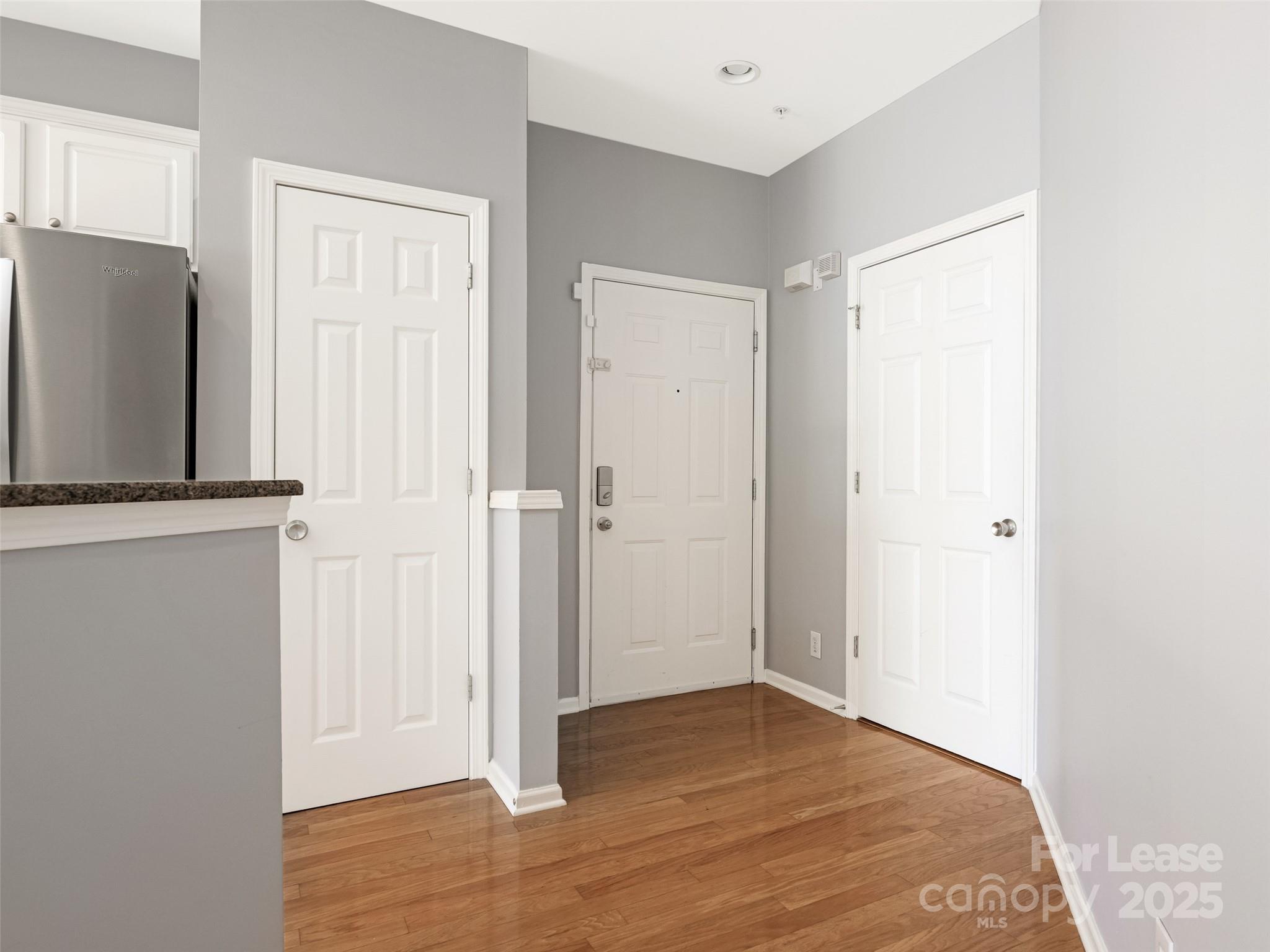 3164 Margellina Drive Charlotte, NC 28210 - Photo 24 of 26 a view of a livingroom with wooden floor and a cabinet