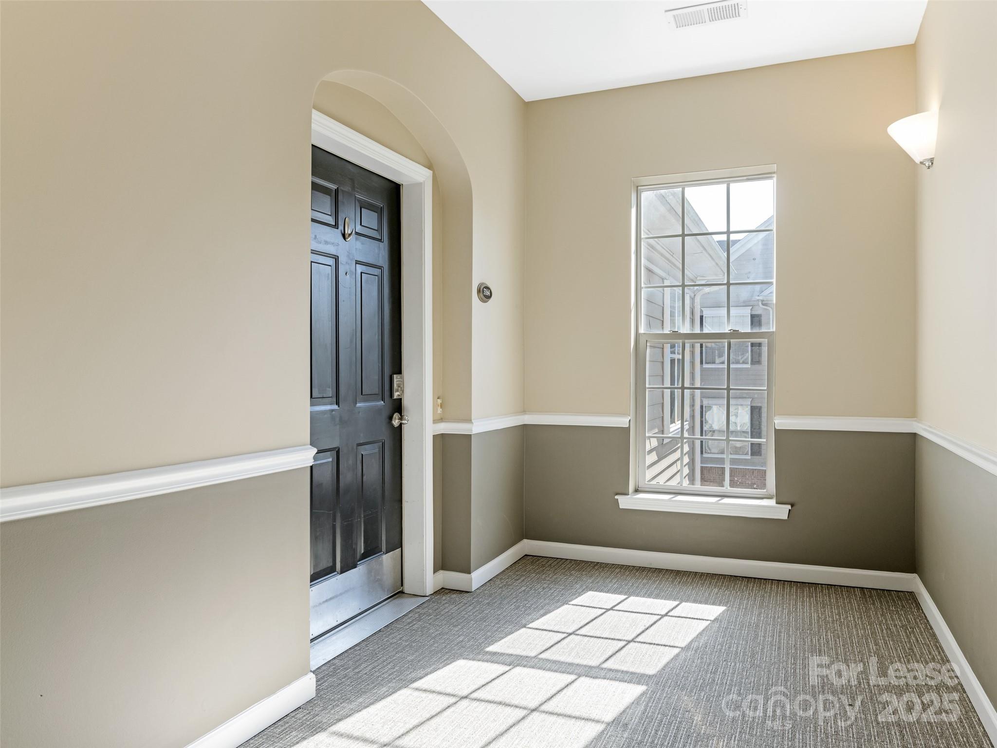 3164 Margellina Drive Charlotte, NC 28210 - Photo 25 of 26 an empty room with windows