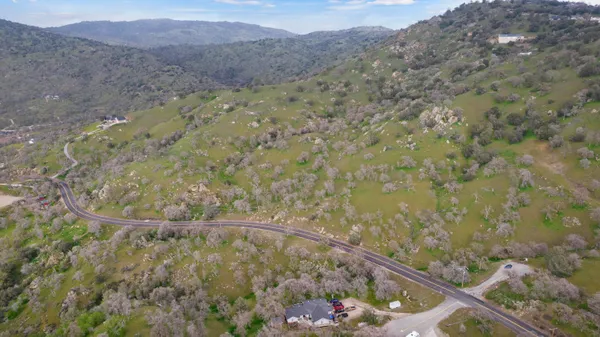 a view of a dry yard with mountain