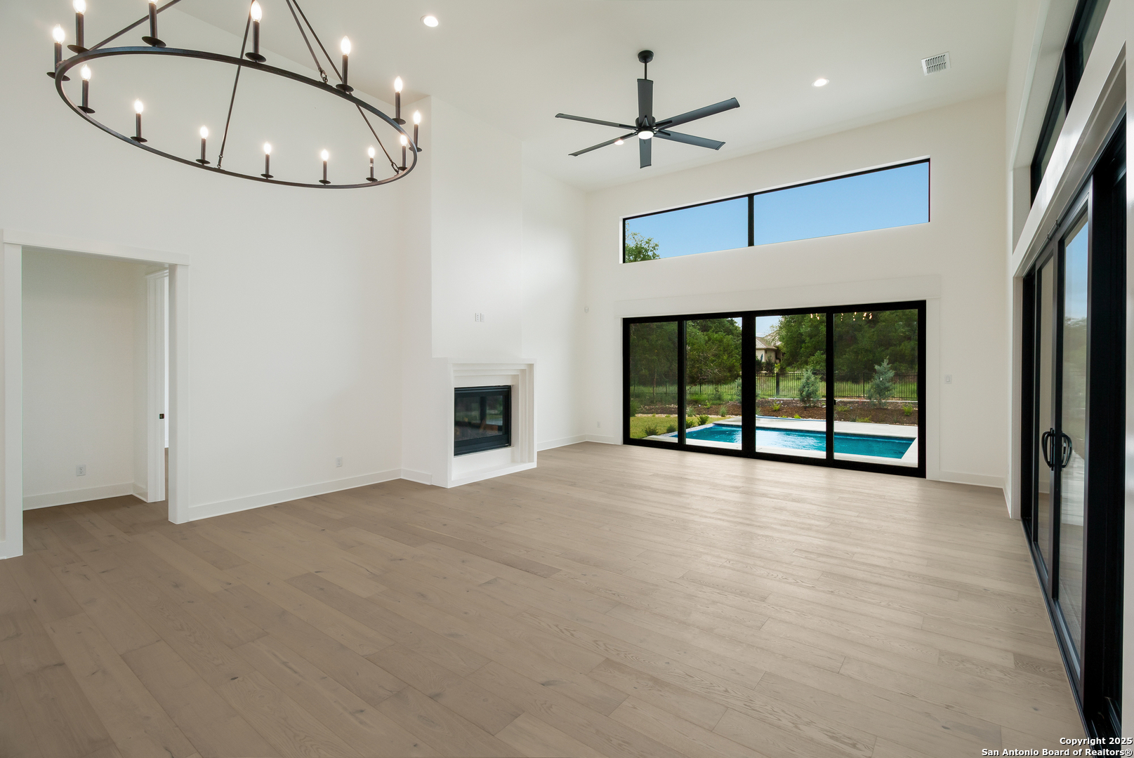 430 Arthur Court Spring Branch, TX 78070 - Photo 13 of 39 a view of an empty room with a chandelier fan and window