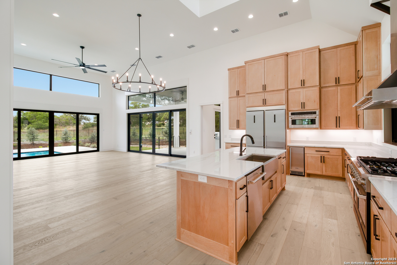 430 Arthur Court Spring Branch, TX 78070 - Photo 16 of 39 a kitchen with stainless steel appliances a stove top oven a sink a counter space and cabinets