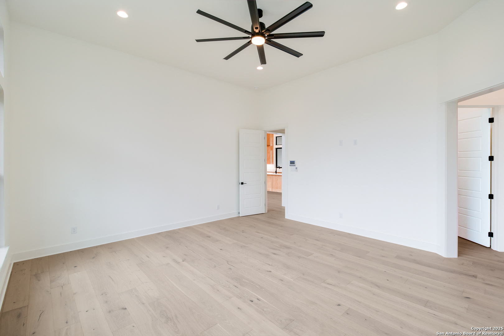430 Arthur Court Spring Branch, TX 78070 - Photo 20 of 39 a view of a room with wooden floor and a ceiling fan