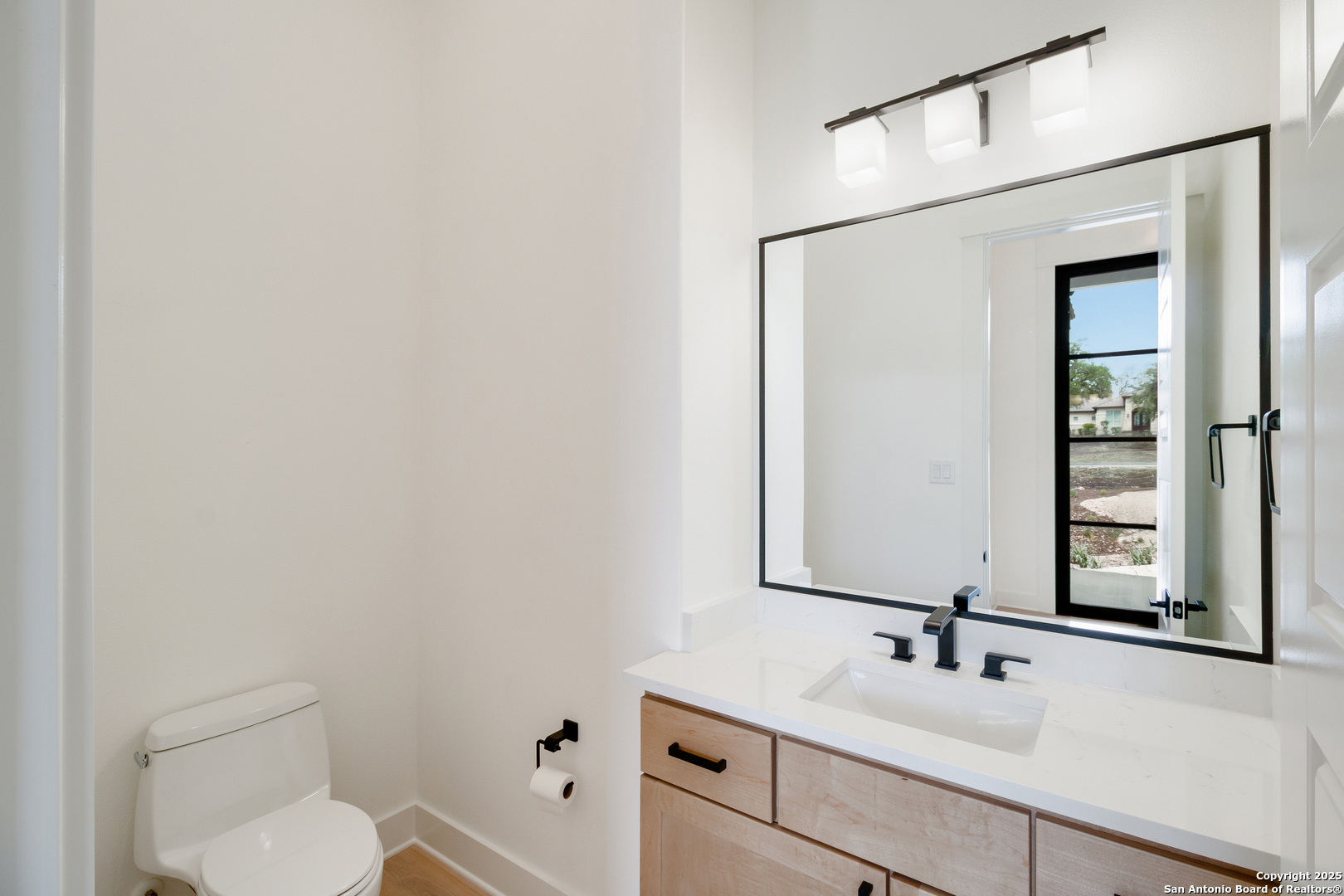 430 Arthur Court Spring Branch, TX 78070 - Photo 29 of 39 a bathroom with a toilet sink and mirror