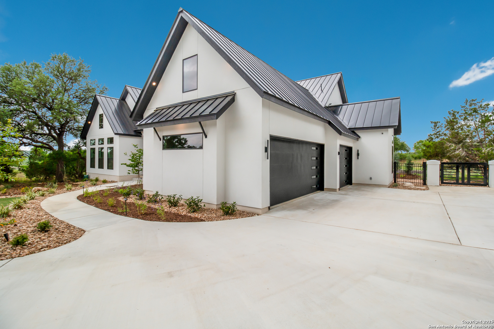 430 Arthur Court Spring Branch, TX 78070 - Photo 5 of 39 a front view of a house with a yard and garage