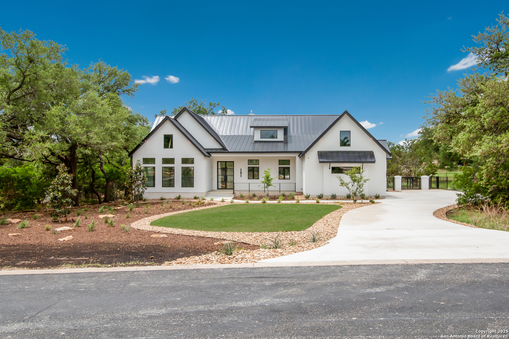 430 Arthur Court Spring Branch, TX 78070 - Photo 8 of 39 a front view of a house with a yard and garage
