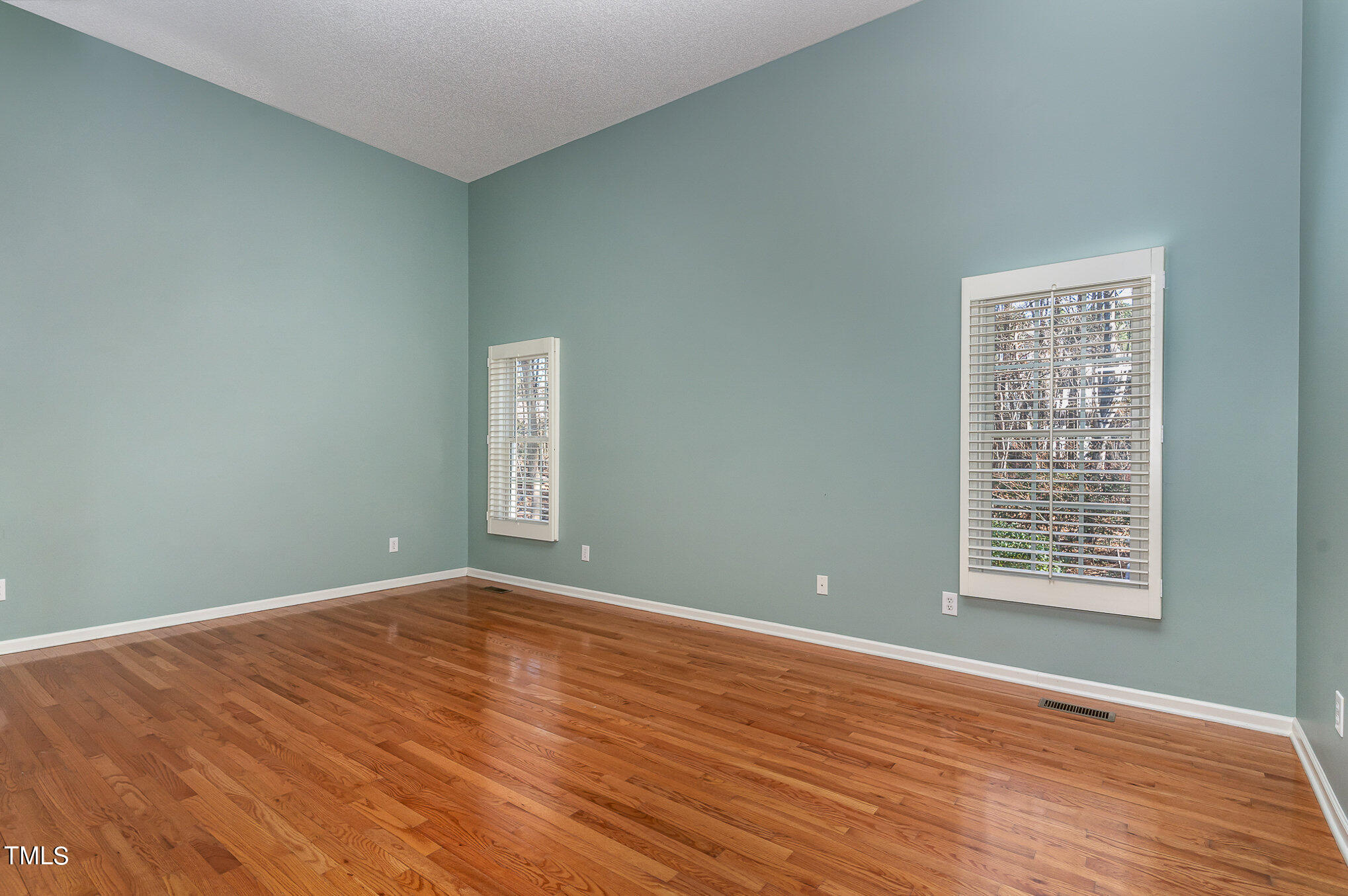 5 Coach Terrace Durham, NC 27713 - Photo 14 of 36 a view of an empty room with wooden floor and a window