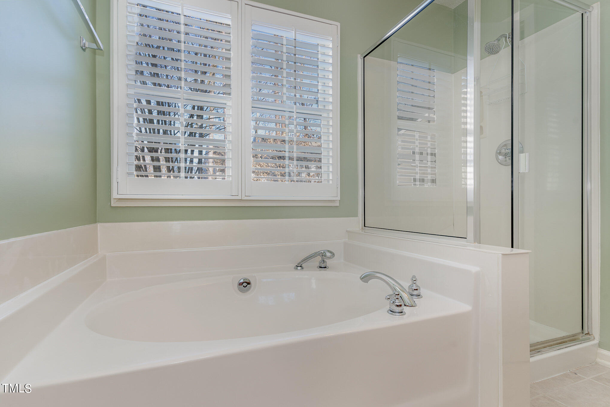 5 Coach Terrace Durham, NC 27713 - Photo 17 of 36 a white bath tub sitting next to a window