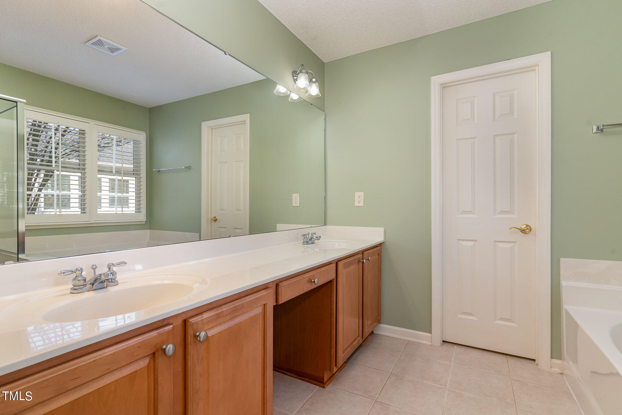 5 Coach Terrace Durham, NC 27713 - Photo 18 of 36 a bathroom with a granite countertop sink and a mirror