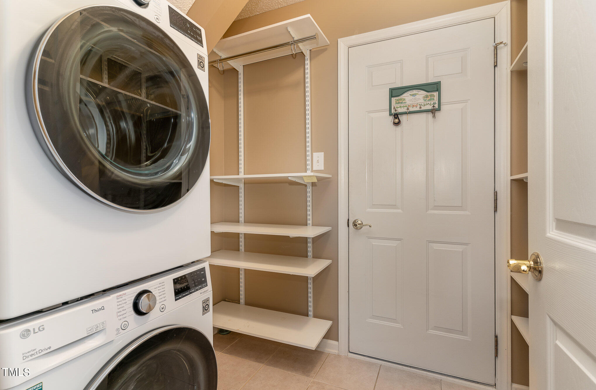 5 Coach Terrace Durham, NC 27713 - Photo 27 of 36 a view of storage and utility room with washer and dryer