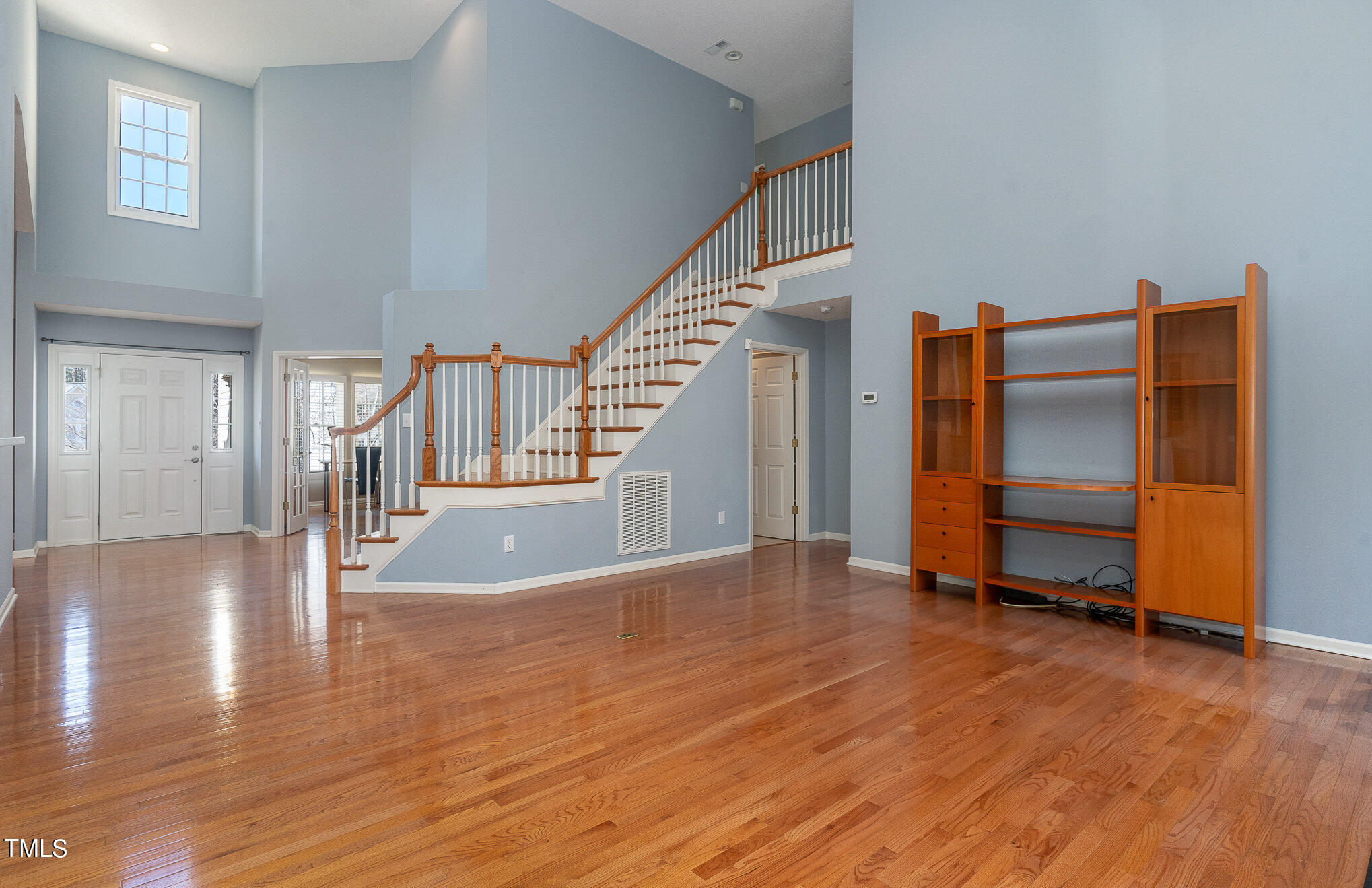 5 Coach Terrace Durham, NC 27713 - Photo 3 of 36 a view of a livingroom with wooden floor and stairs