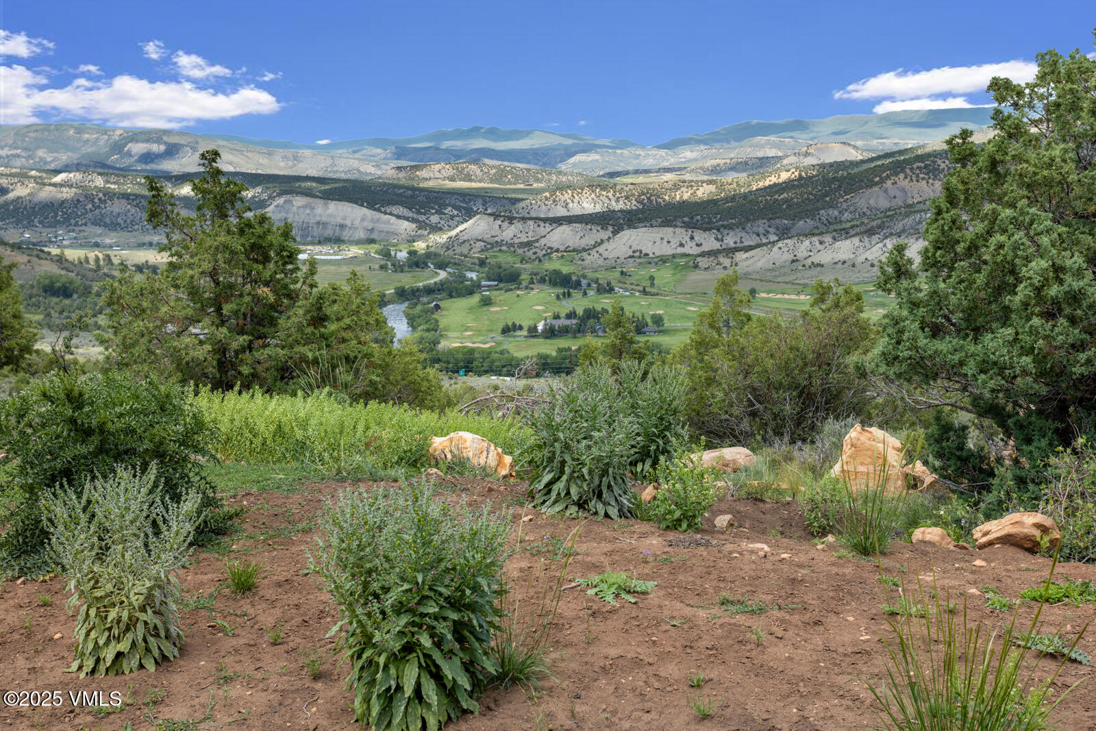 1463 Wolcott Springs Road Wolcott, CO 81655 - Photo 4 of 27 a view of a lake with a mountain