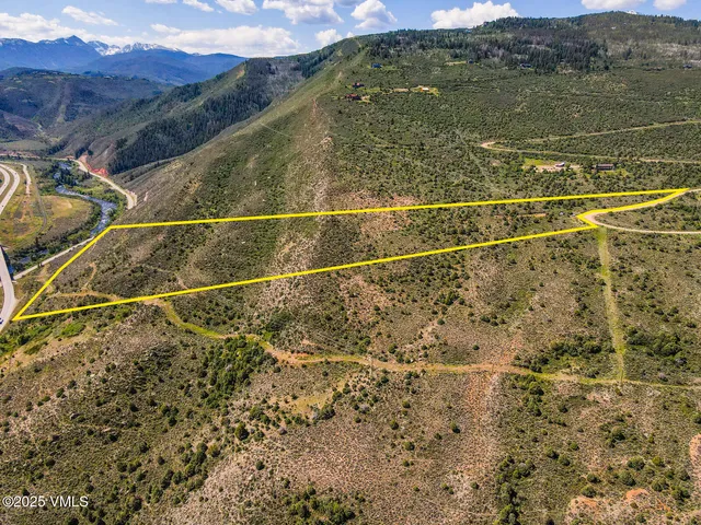 a view of a swimming pool with a yard