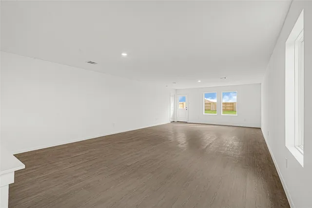 an empty room with a empty space and window