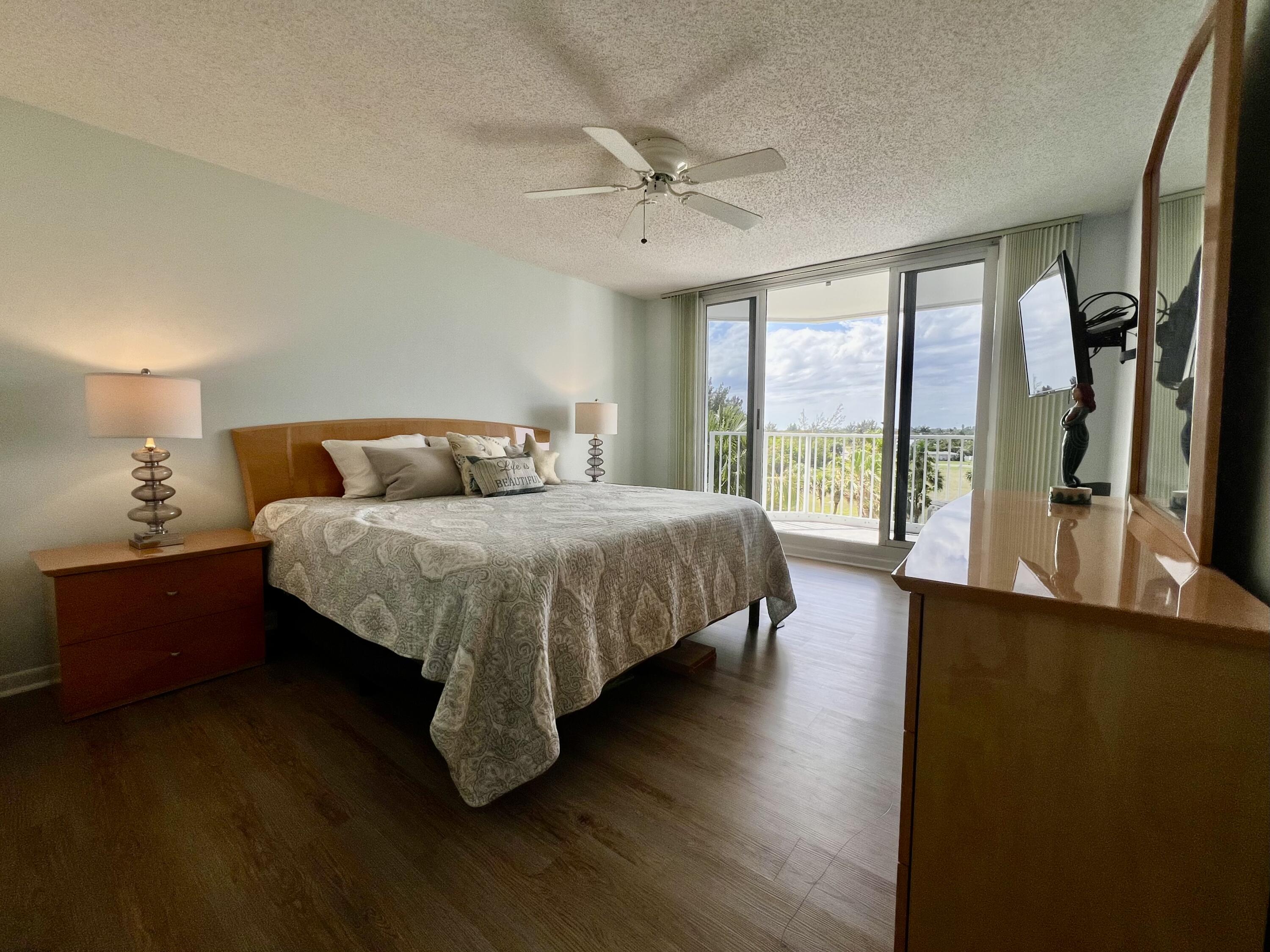 2700 North Hwy A1A, Unit 506 Fort Pierce, FL 34949 - Photo 13 of 28 a bedroom with a bed and a large window