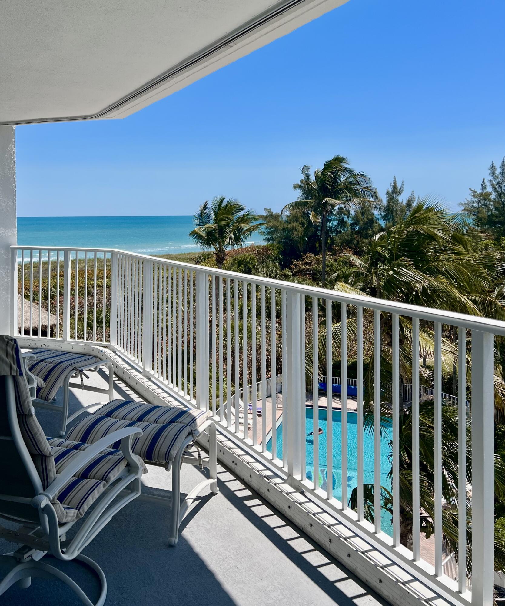 2700 North Hwy A1A, Unit 506 Fort Pierce, FL 34949 - Photo 14 of 28 a view of a balcony with wooden floor and outdoor seating