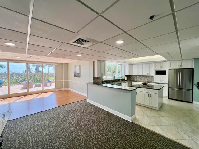 a kitchen with stainless steel appliances granite countertop a sink and cabinets