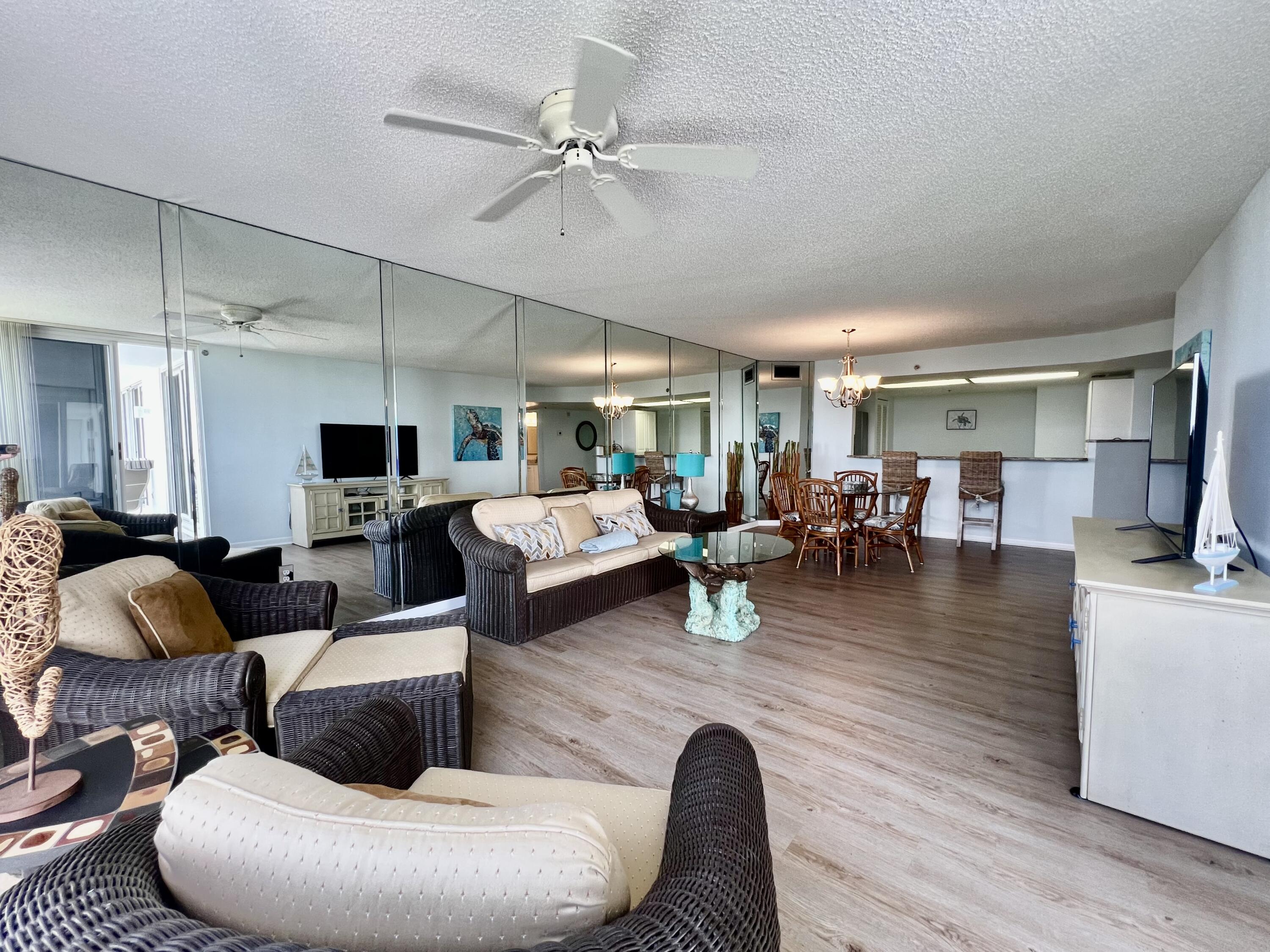 2700 North Hwy A1A, Unit 506 Fort Pierce, FL 34949 - Photo 10 of 28 a living room with furniture and a wooden floor
