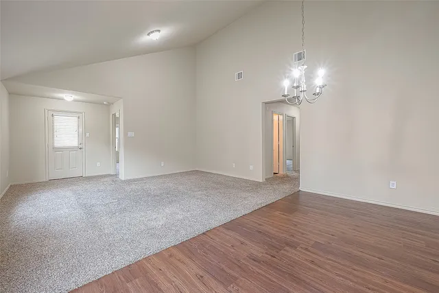 a view of a kitchen with a sink and a refrigerator