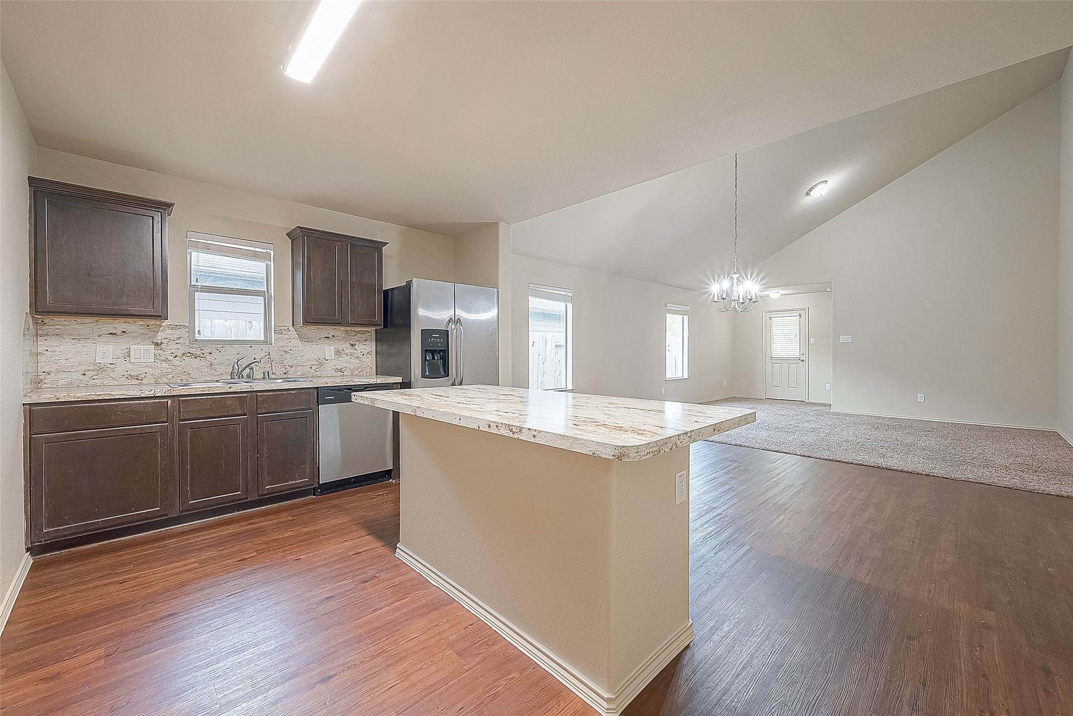 2038 Treasure Mountain Drive Spring, TX 77388 - Photo 17 of 45 a large kitchen with granite countertop a sink and cabinets
