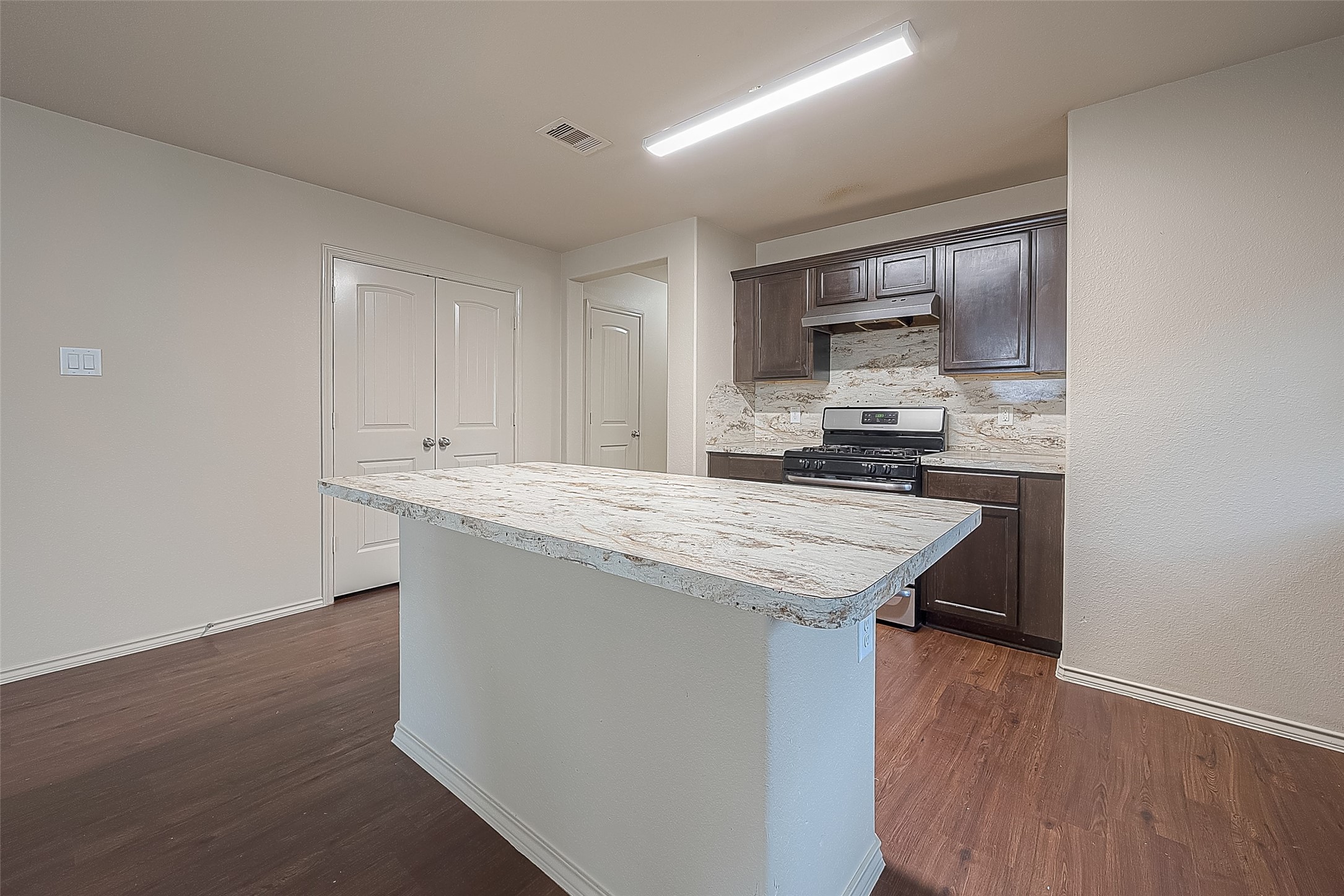 2038 Treasure Mountain Drive Spring, TX 77388 - Photo 18 of 45 a kitchen with a sink a microwave and cabinets