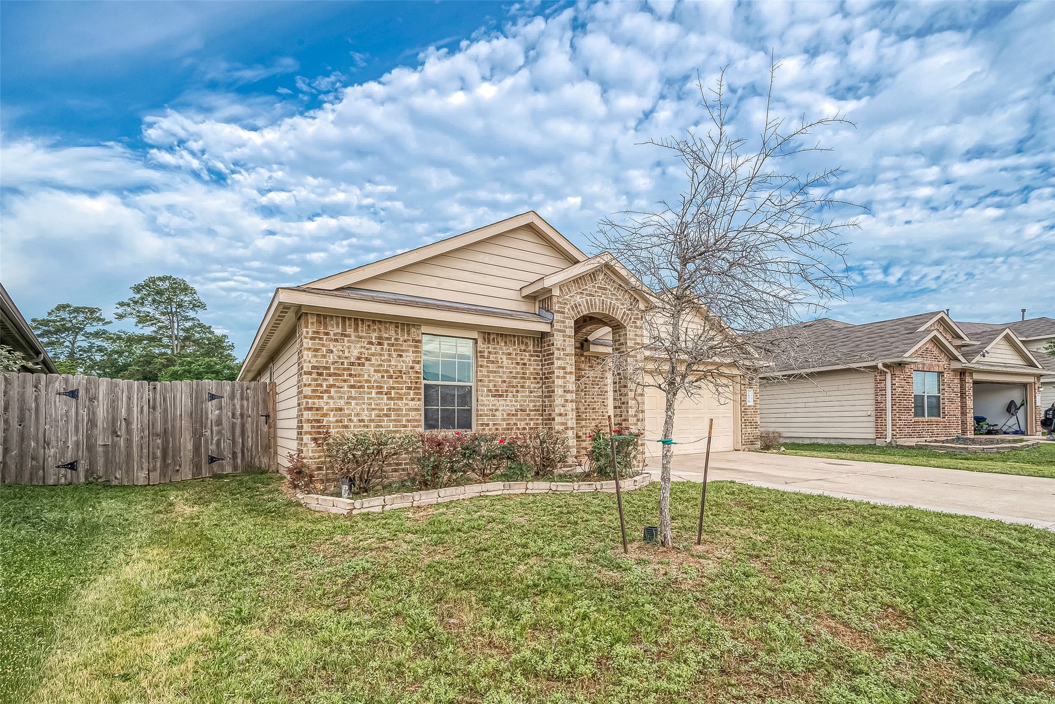 2038 Treasure Mountain Drive Spring, TX 77388 - Photo 2 of 45 a front view of a house with garden