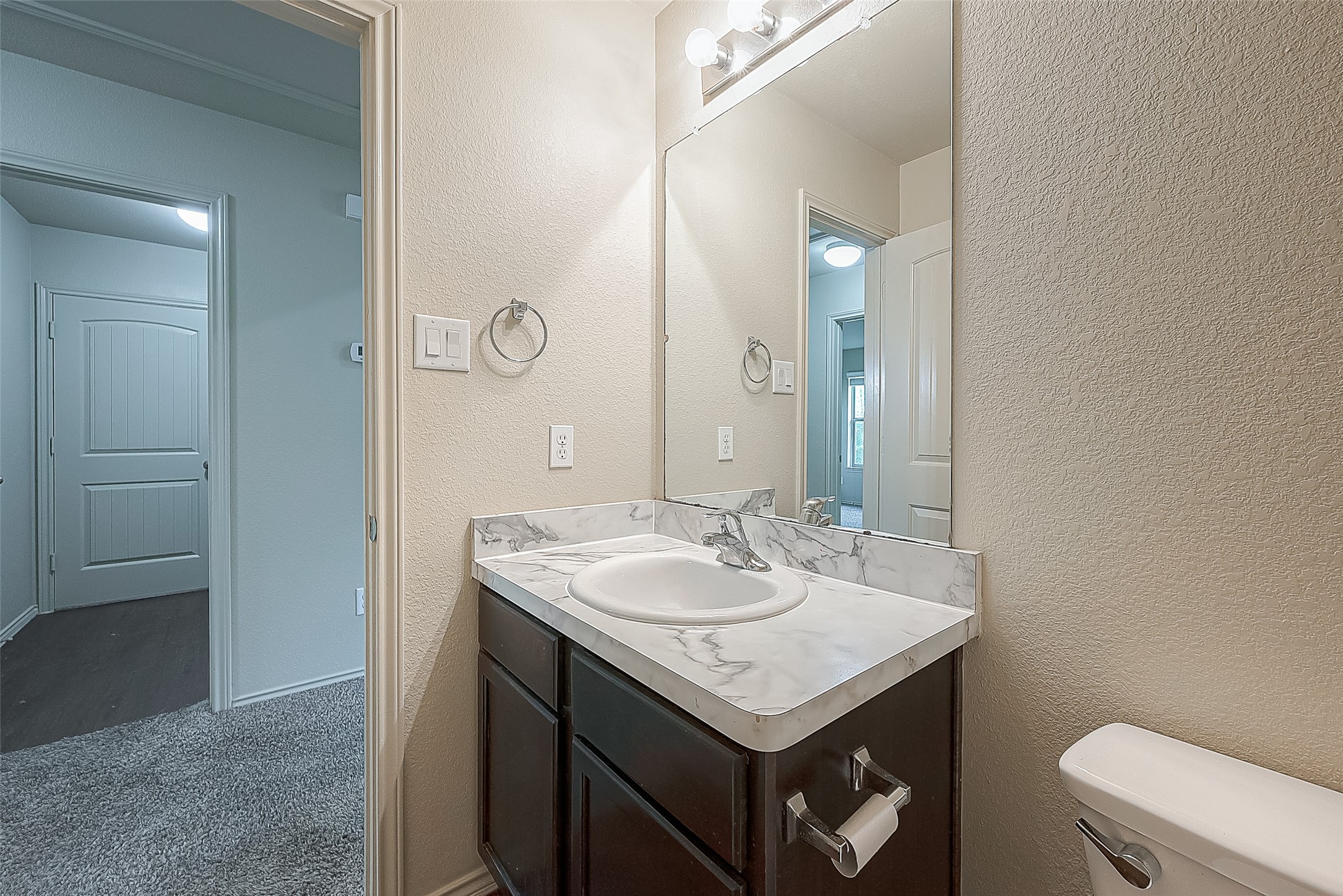 2038 Treasure Mountain Drive Spring, TX 77388 - Photo 33 of 45 a bathroom with a sink a toilet and a mirror