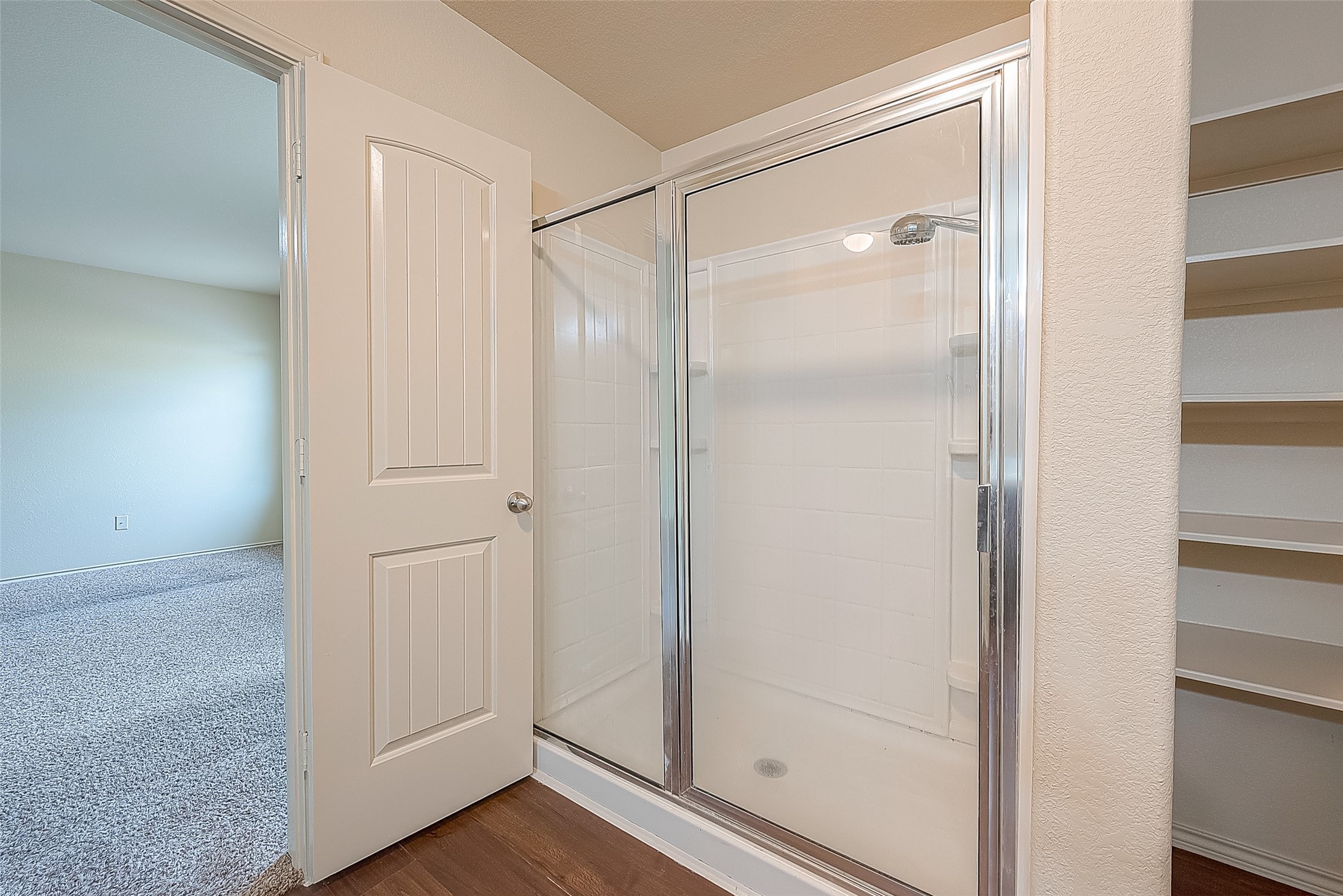 2038 Treasure Mountain Drive Spring, TX 77388 - Photo 39 of 45 a bathroom with a glass shower door