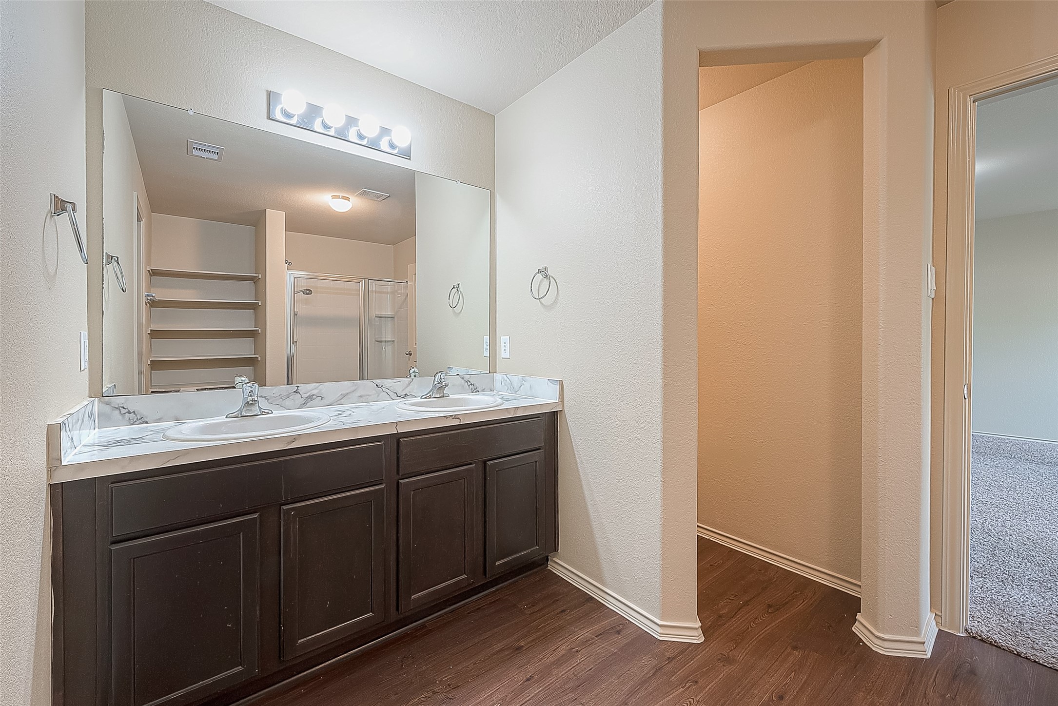 2038 Treasure Mountain Drive Spring, TX 77388 - Photo 40 of 45 a bathroom with a granite countertop sink and a mirror