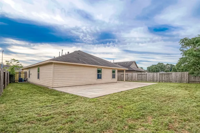 a backyard of a house with lots of green space