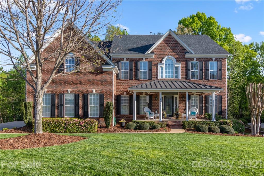 1933 Faison Avenue, Unit 69 Fort Mill, SC 29708 - Photo 1 of 40 a front view of a house with swimming pool and green space