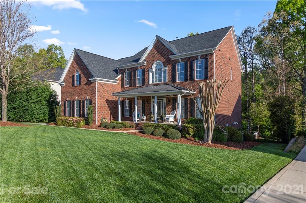 1933 Faison Avenue, Unit 69 Fort Mill, SC 29708 - Photo 2 of 40 a front view of a house with a yard
