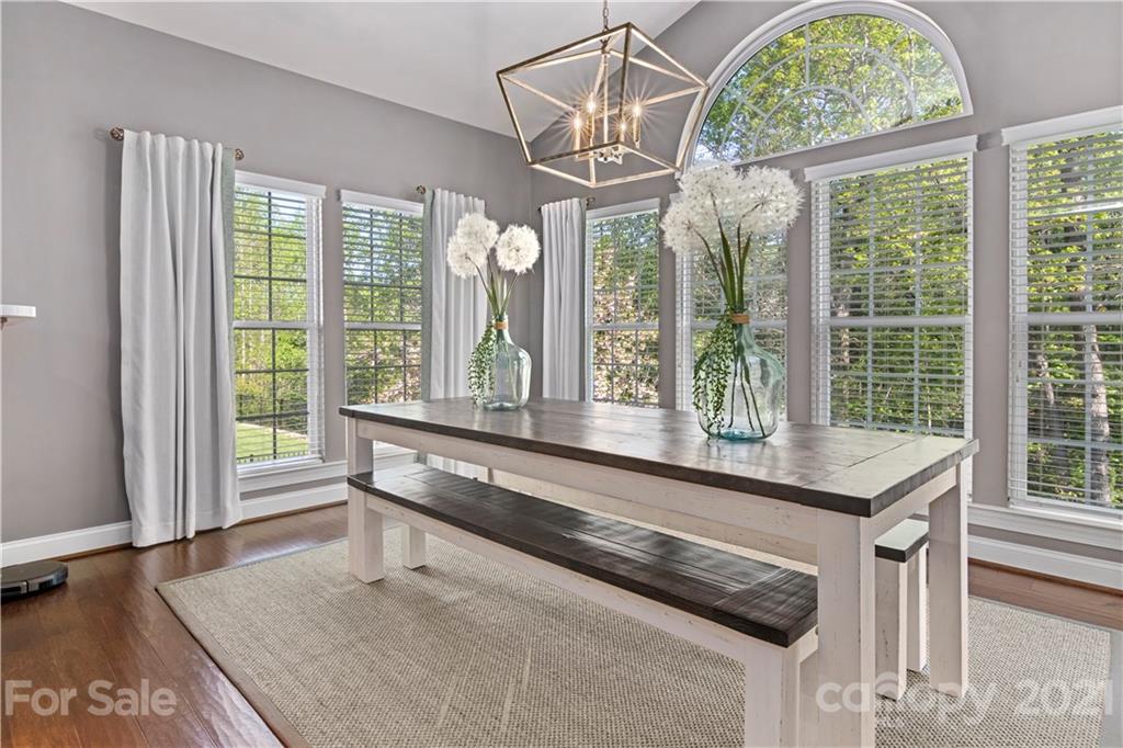 1933 Faison Avenue, Unit 69 Fort Mill, SC 29708 - Photo 12 of 40 a living room with a large window and chandelier