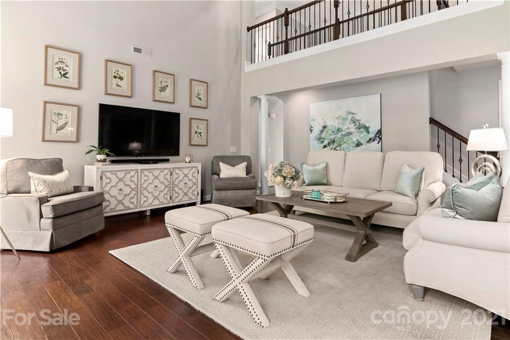 1933 Faison Avenue, Unit 69 Fort Mill, SC 29708 - Photo 13 of 40 a living room with furniture a flat screen tv and a flat screen tv