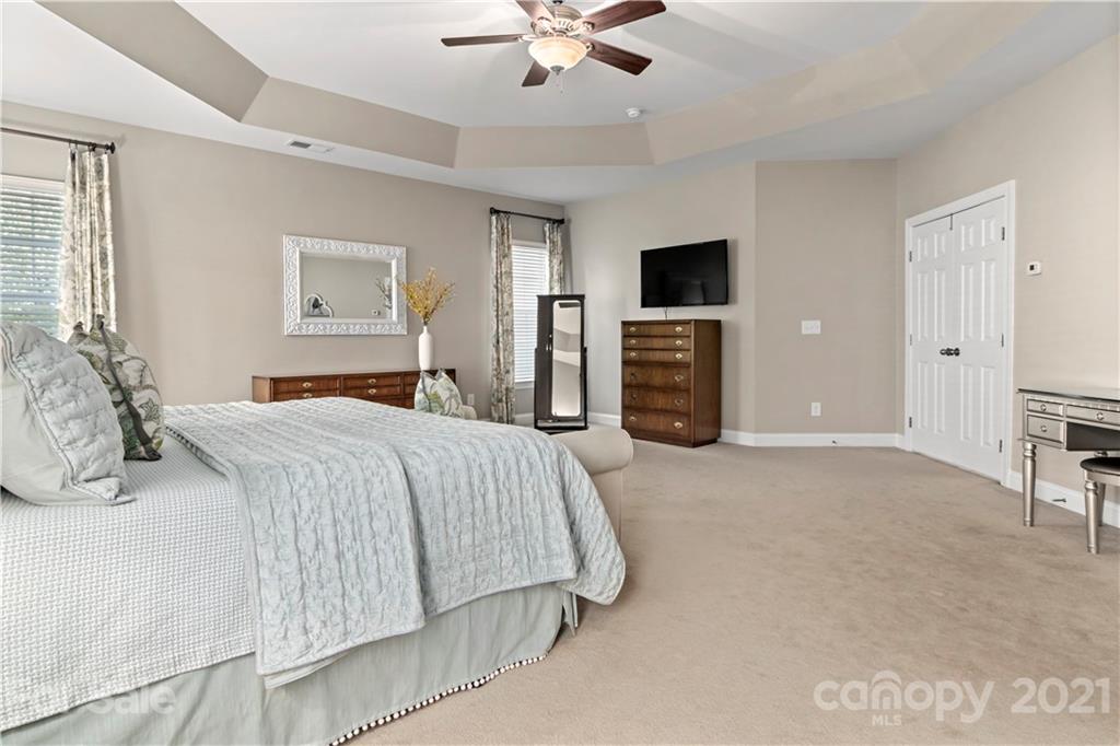 1933 Faison Avenue, Unit 69 Fort Mill, SC 29708 - Photo 18 of 40 a bedroom with a bed and a flat screen tv