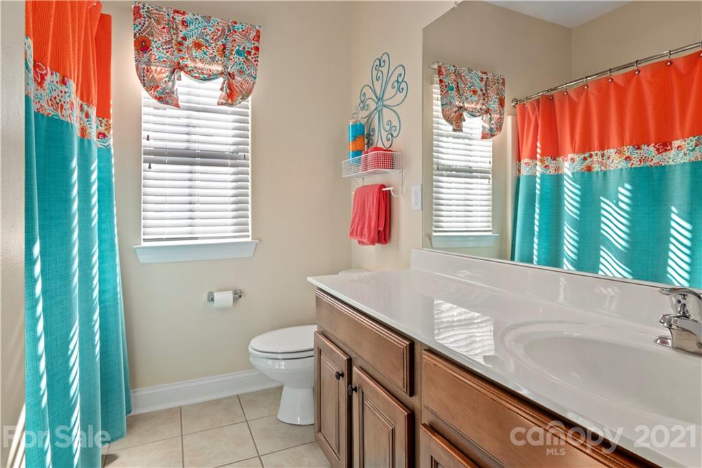 1933 Faison Avenue, Unit 69 Fort Mill, SC 29708 - Photo 25 of 40 a bathroom with a sink a toilet and a window