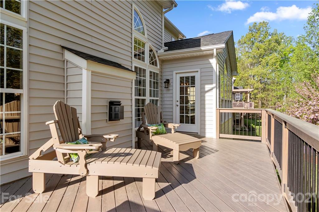 1933 Faison Avenue, Unit 69 Fort Mill, SC 29708 - Photo 32 of 40 a view of a patio with table and chairs and wooden floor