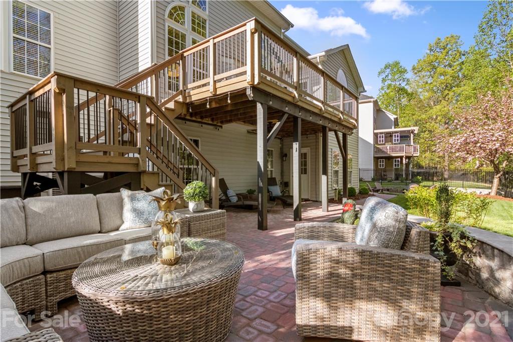 1933 Faison Avenue, Unit 69 Fort Mill, SC 29708 - Photo 33 of 40 a view of a patio with couches table and chairs and potted plants