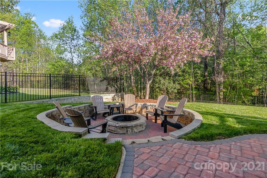 1933 Faison Avenue, Unit 69 Fort Mill, SC 29708 - Photo 36 of 40 a view of a chair and table in the garden