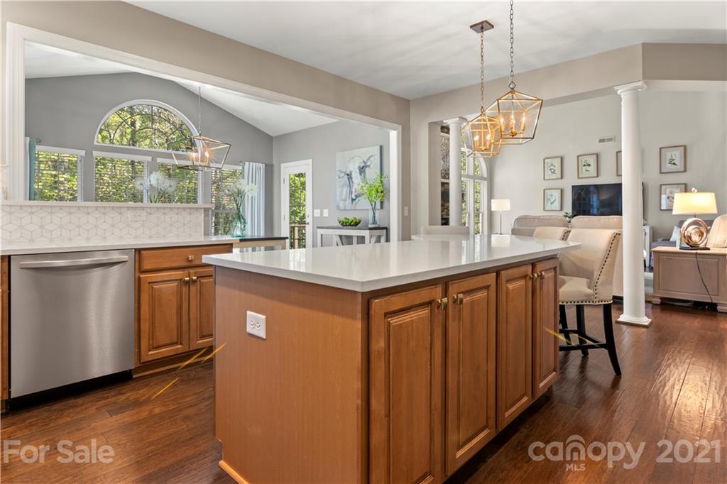 1933 Faison Avenue, Unit 69 Fort Mill, SC 29708 - Photo 9 of 40 a very nice looking kitchen with granite countertop a stove a sink a dining table and chairs