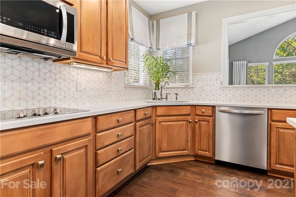 1933 Faison Avenue, Unit 69 Fort Mill, SC 29708 - Photo 10 of 40 a kitchen with stainless steel appliances granite countertop a sink and a microwave