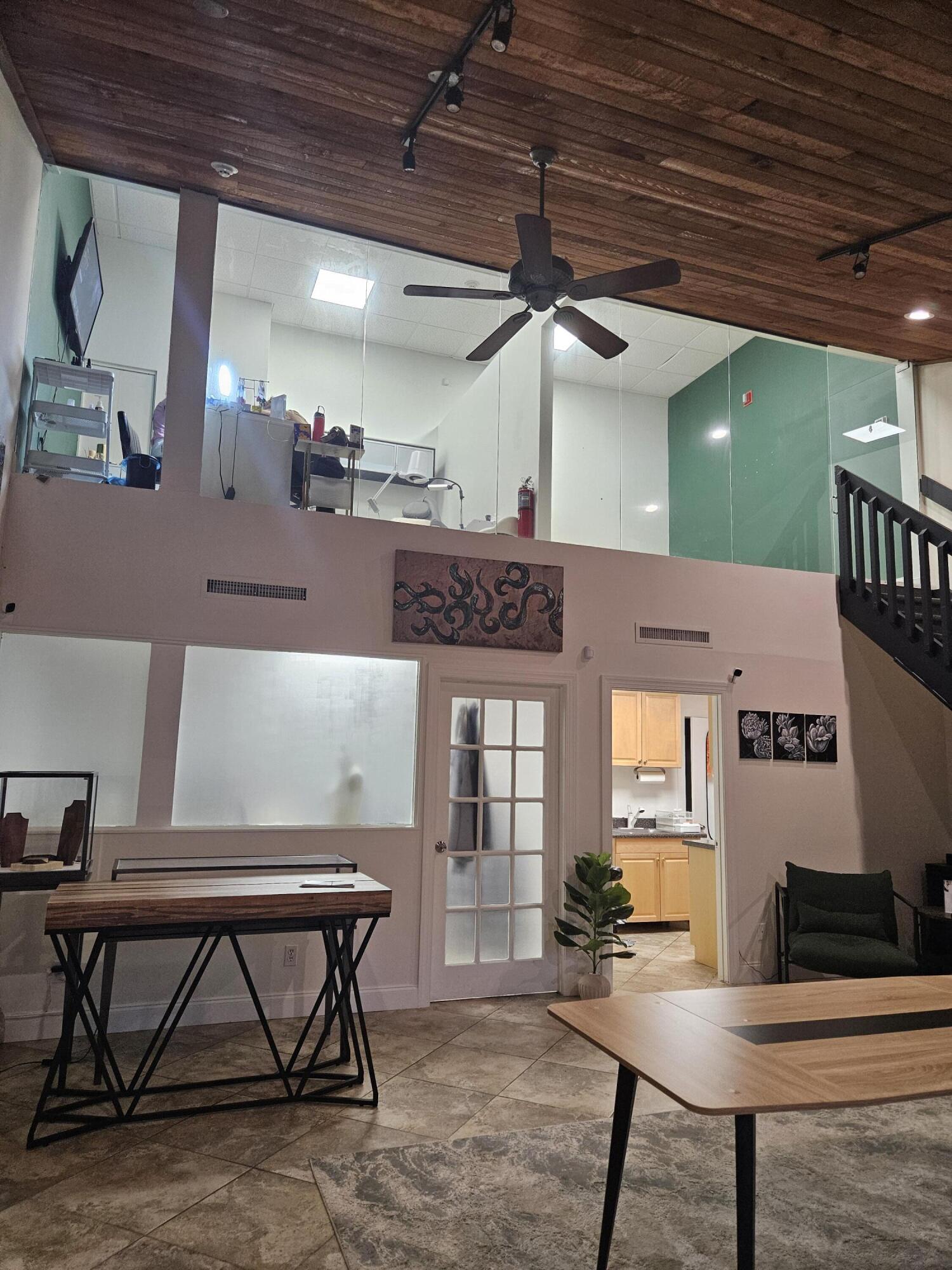 a view of a livingroom with furniture and window