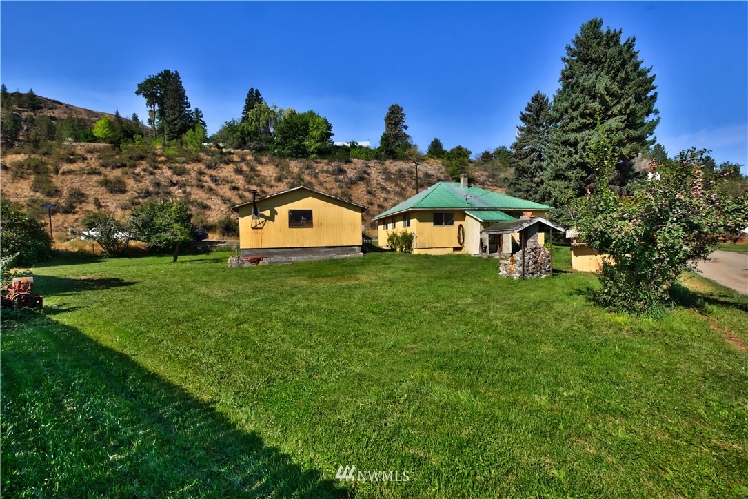 628 Twisp Carlton Road Twisp, WA 98856 - Photo 1 of 32 a view of a house with a big yard