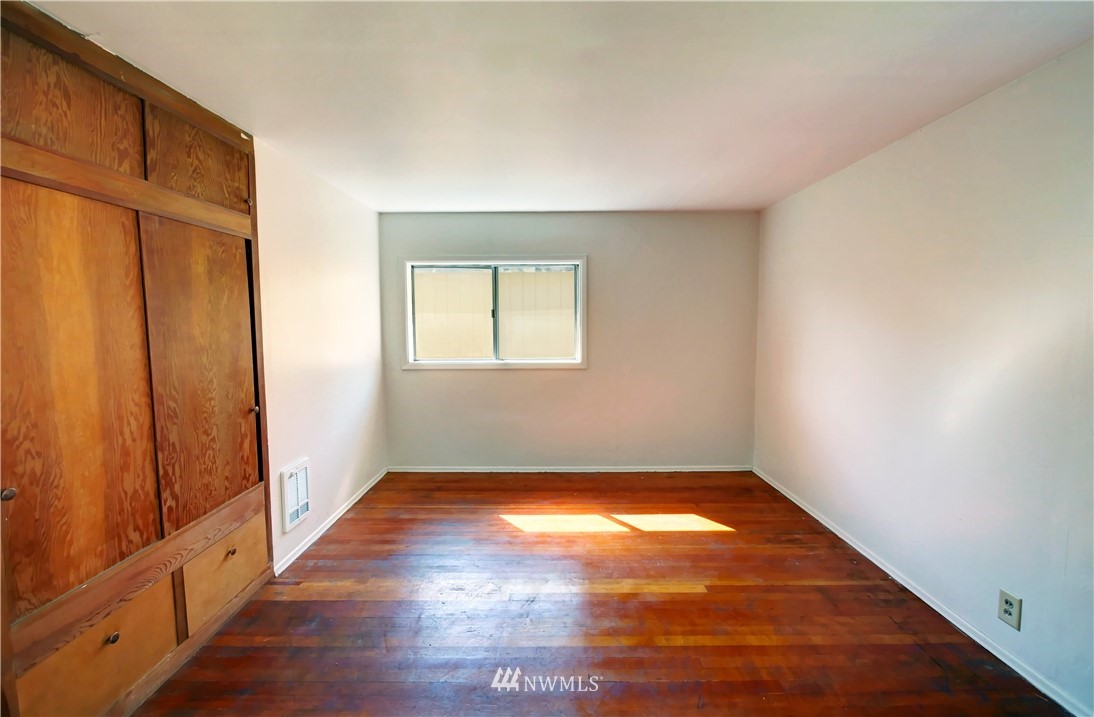 628 Twisp Carlton Road Twisp, WA 98856 - Photo 15 of 32 a view of a big room with wooden floor and windows