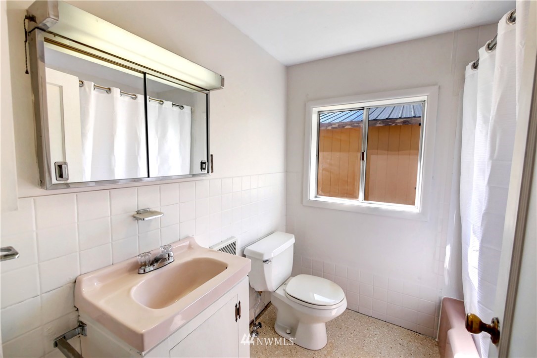 628 Twisp Carlton Road Twisp, WA 98856 - Photo 16 of 32 a bathroom with a sink and a toilet