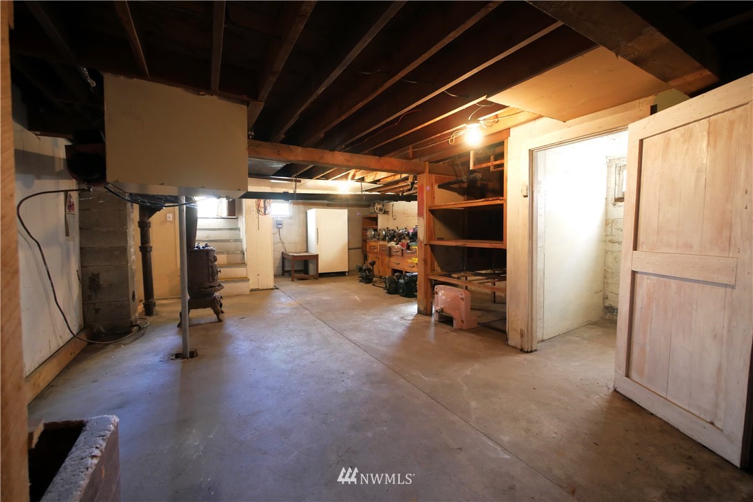 628 Twisp Carlton Road Twisp, WA 98856 - Photo 21 of 32 a view of empty room with wooden floor