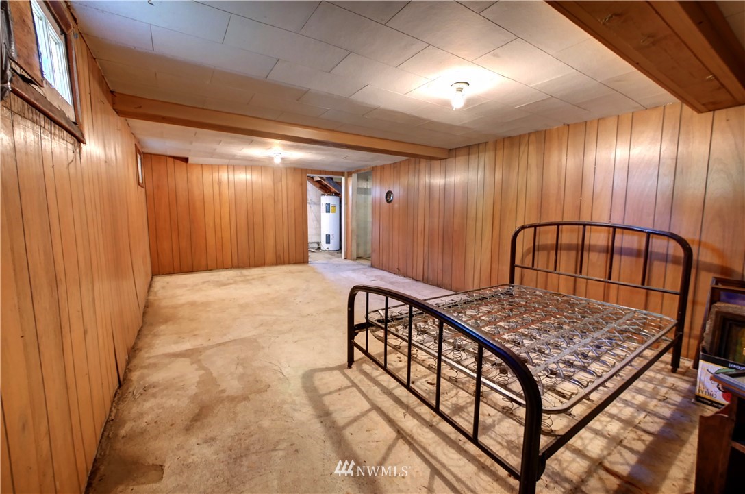 628 Twisp Carlton Road Twisp, WA 98856 - Photo 23 of 32 a view of a hallway with a door and wooden floor